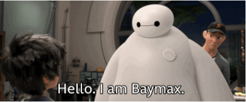 An animated gif of a giant, white balloonish robot waving its hand and saying "Hello. I am Baymax."